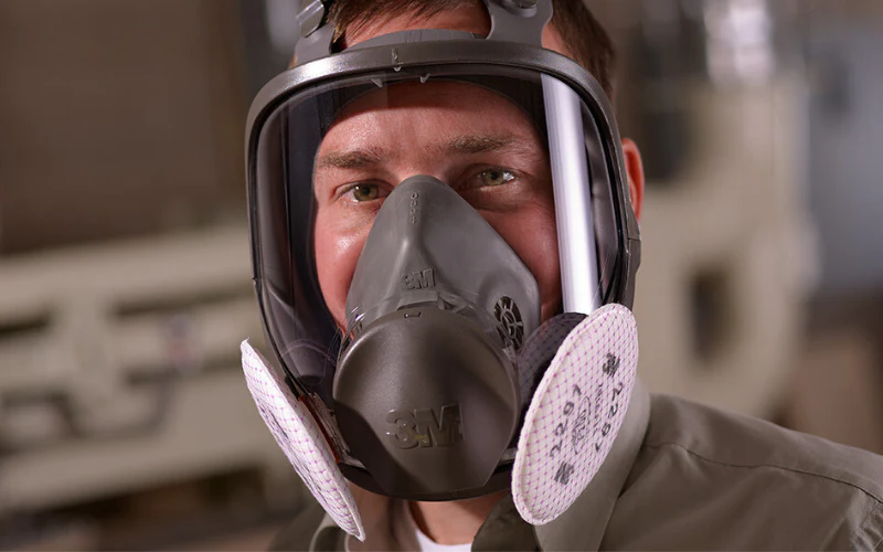 Mold Safe Solutions technician wearing a full-face respirator for mold removal in Oceanside, CA